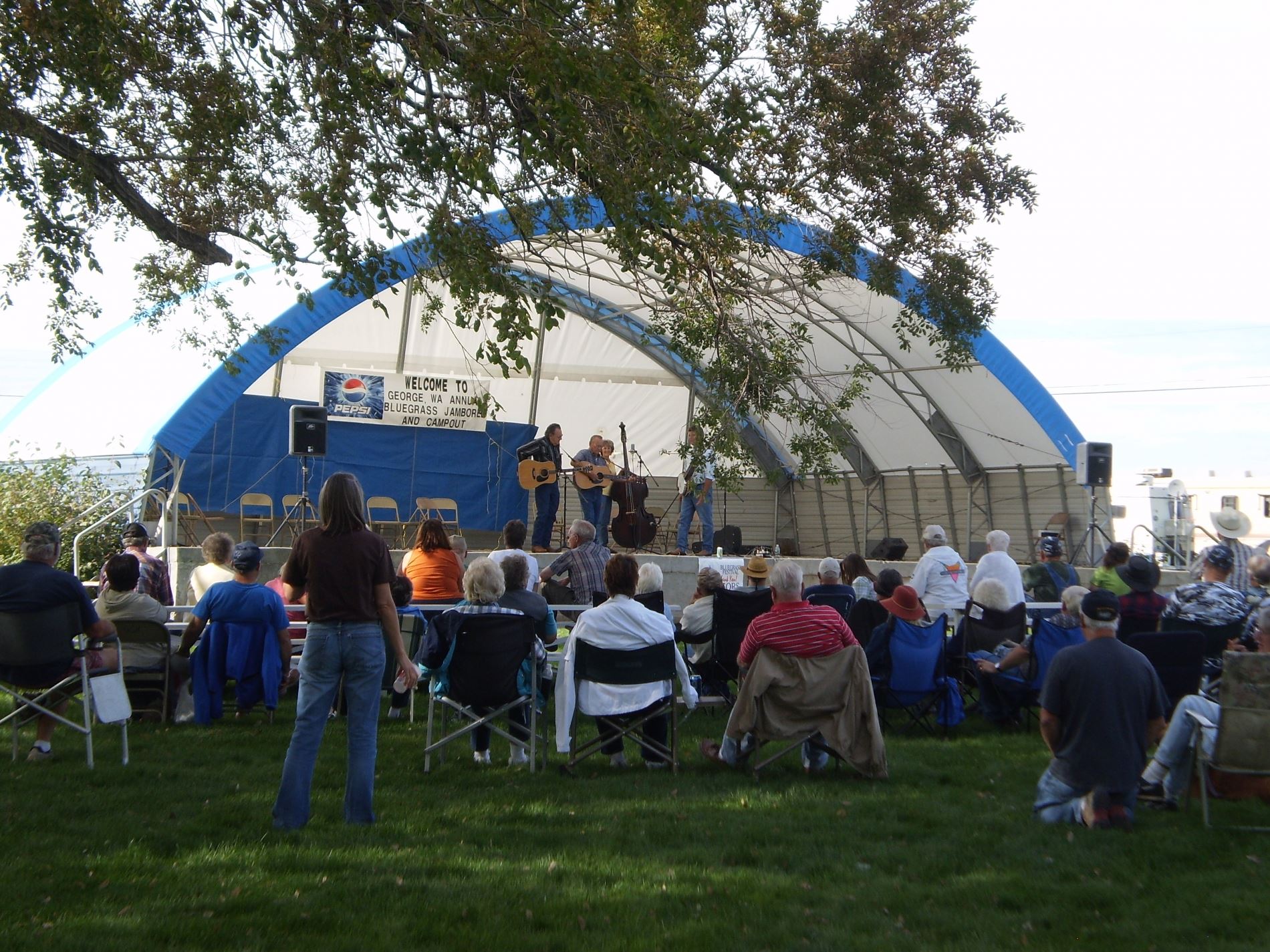 People listening to an outdoor concert