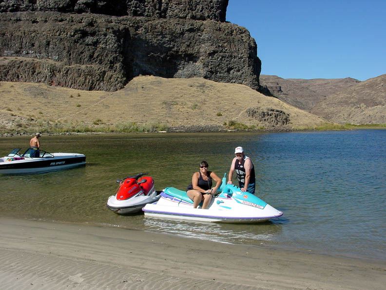 Two people by jet-skis