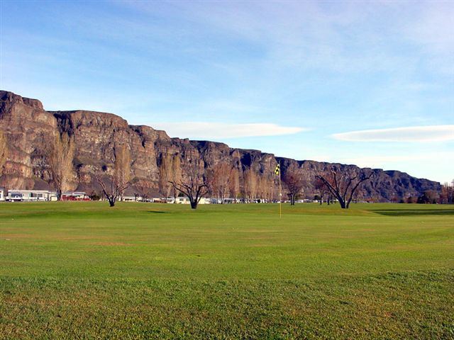 Field by a mountain