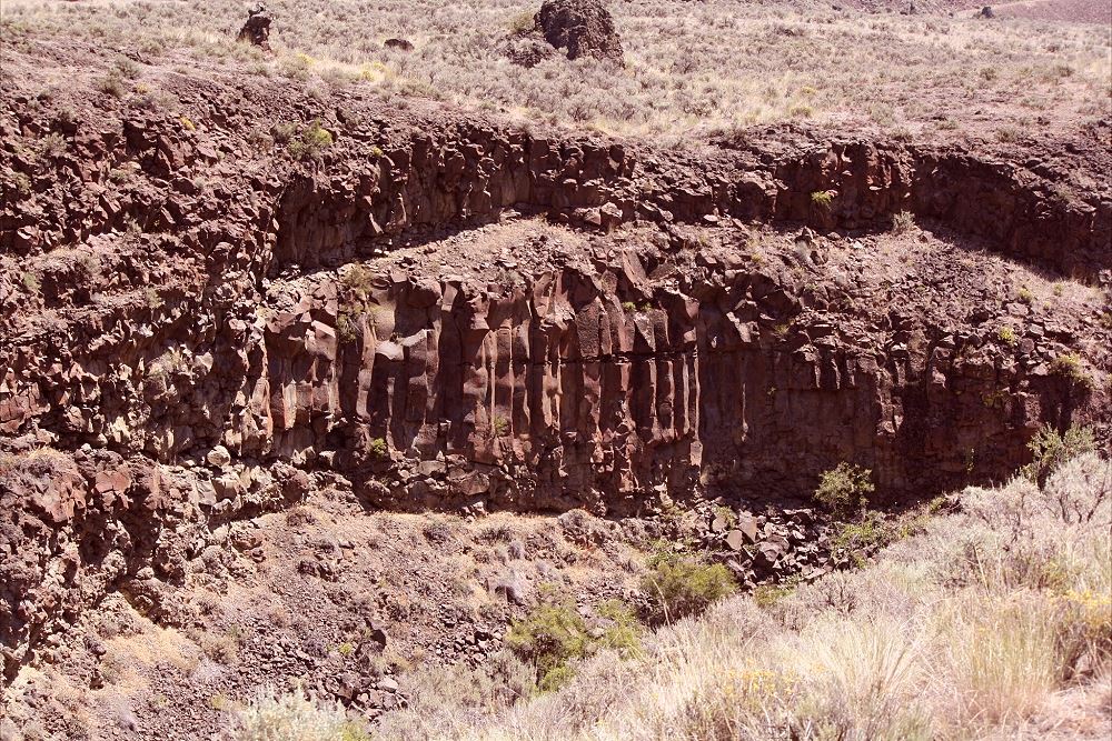 Basalt Column with greenery around it