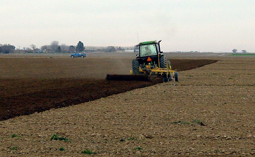 Tractor plowing a field